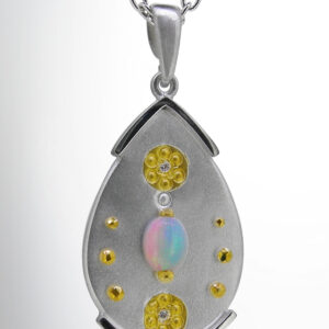 Moonstone drop pendant with diamonds, gold and silver