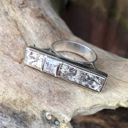 Contemporary Bark texture engagement ring in white gold and a Princess cut diamond