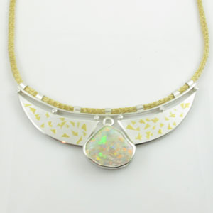 Pendant-with-fossilized-Opal-shell-and-six-.02ct-diamonds300x300